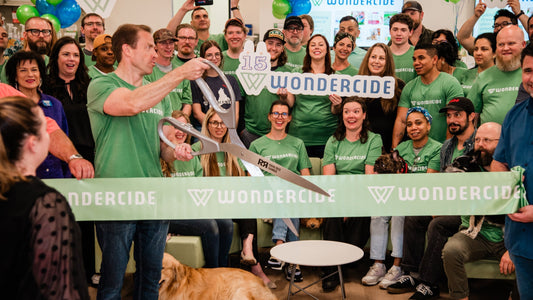 Wondercide team celebrating their 15th anniversity with a ribbon cutting ceremony