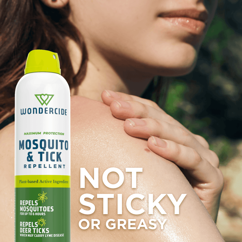 Wondercide Mosquito & Tick Repellent spray canister shown in front of a close-up of a woman's face and shoulder, with large text reading 'NOT STICKY OR GREASY'.