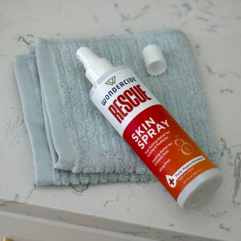 Wondercide Rescue Skin Spray and towel
