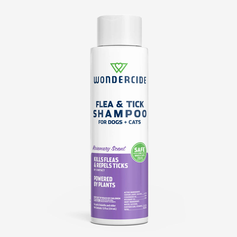 A white bottle of Wondercide Flea & Tick Shampoo for dogs and cats, featuring rosemary scent with purple and green labeling. Label notes that it's plant-powered, kills fleas, and repels ticks.