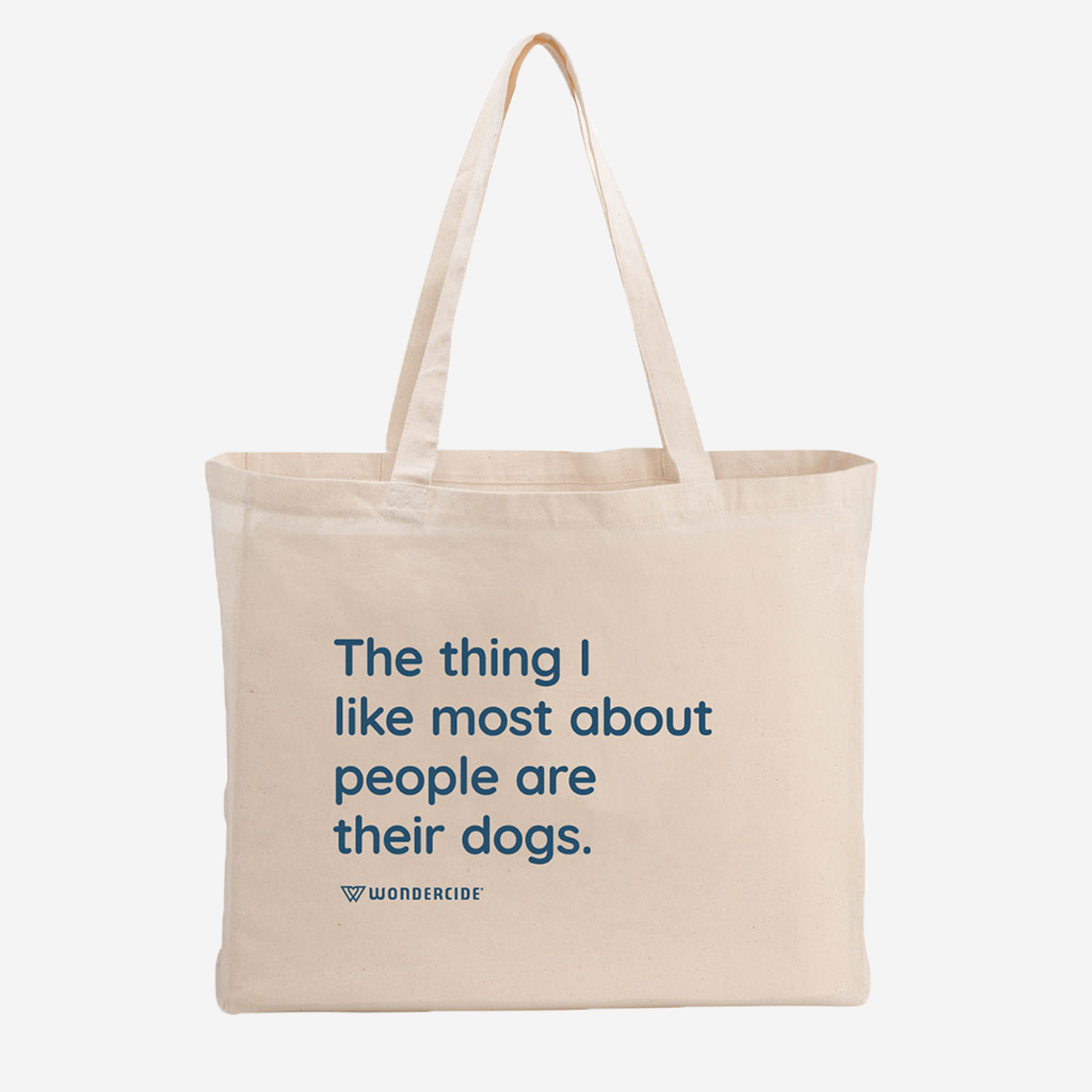 The Suns Out Tongues Out Tote by Wondercide features a stylish beige design with blue text stating, The thing I like most about people are their dogs, and the Wondercide logo underneath. Chic and convenient, it stands out against a plain white background.