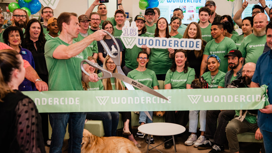 Wondercide team celebrating their 15th anniversity with a ribbon cutting ceremony 
