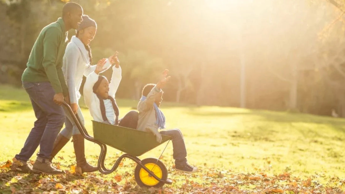Family cleaning up leaves