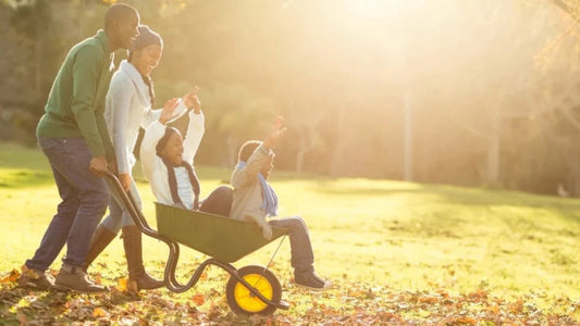 Family cleaning up leaves