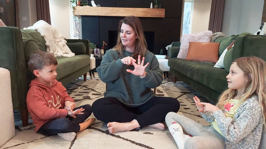 Wondercide founder and CEO Stephanie Boone sits on the floor with her kids and practices the starfish meditation