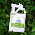 A white Wondercide Ready-to-Use Outdoor Mosquito Spray bottle sits on green leaves. Its label shows a hose attachment for easy yard, patio, and landscape use, providing safe pest protection that kills mosquitoes and fleas.