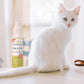 Wondercide Flea & Tick Spray with a white cat