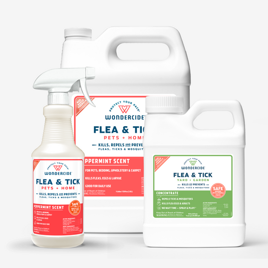 Wondercides Home Treatment Kit features three products: a spray bottle and two jugs. The labels, scented with essential oils, read Flea & Tick for Pets + Home and Flea & Tick for Yard + Garden, promising to kill, repel, and prevent infestations effectively.