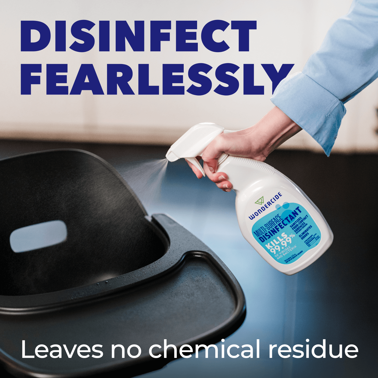 Person using a disinfectant spray on a surface with text 'Disinfect Fearlessly' and 'Leaves no chemical residue'.
