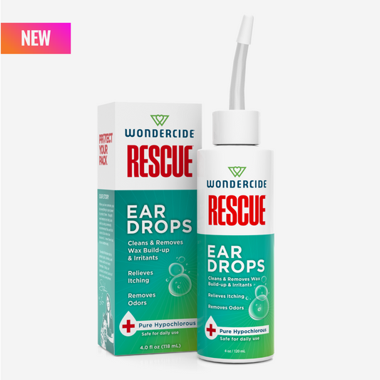 A bottle and box of Wondercide RESCUE™ Ear Drops for Dogs & Cats, in green and white packaging. The alcohol-free label highlights cleaning, ear wax removal, itch relief, and odor removal. A NEW label is in the top left corner.