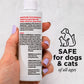 A hand with lavender-painted nails holds a white bottle labeled Wondercide RESCUE™ Ear Drops for Dogs & Cats, next to a graphic of a dog and cat with the words SAFE for dogs & cats—helps prevent wax build-up.