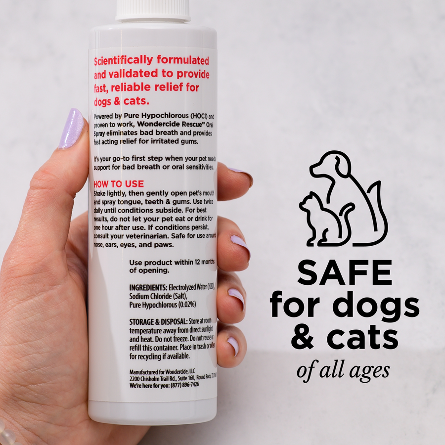 A hand holds a bottle of Wondercide RESCUE™ Oral Spray, an alcohol-free pet care product. Text describes usage and ingredients. Beside it, a graphic shows a dog and cat with: “SAFE for dogs & cats of all ages. Perfect for daily oral care.”.
