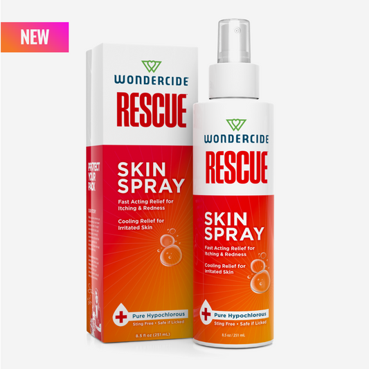 A bottle and box of Wondercide RESCUE™ Skin Spray for Dogs & Cats are shown with white and red packaging. The NEW label is in the top left, highlighting relief for itching and redness with pure hypochlorous for sensitive areas.