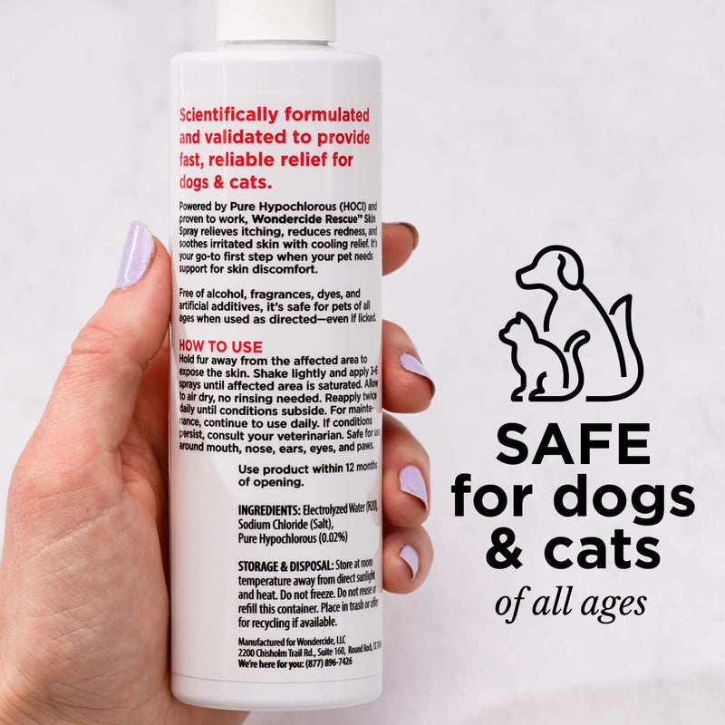 A hand holds a Wondercide RESCUE™ Skin Spray bottle, labeled with instructions and ingredients for skin relief. Beside it, a line drawing of a dog and cat shows the text, “SAFE for dogs & cats of all ages.” Safe for sensitive areas.