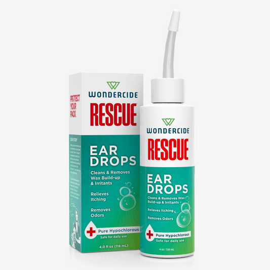 A bottle of Wondercide RESCUE™ Ear Drops for Dogs & Cats with a nozzle appears beside its box, highlighting benefits like wax removal, relief from irritation and itching, odor reduction, and safe daily use with Pure Hypochlorous.