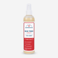 A bottle of Wondercide Skin Tonic Itch Spray for Dogs + Cats features a red and white label, promoting Natural Relief for Itch + Allergy with neem oil. It acts quickly, enhances skin health, and cautions to keep out of reach of children.